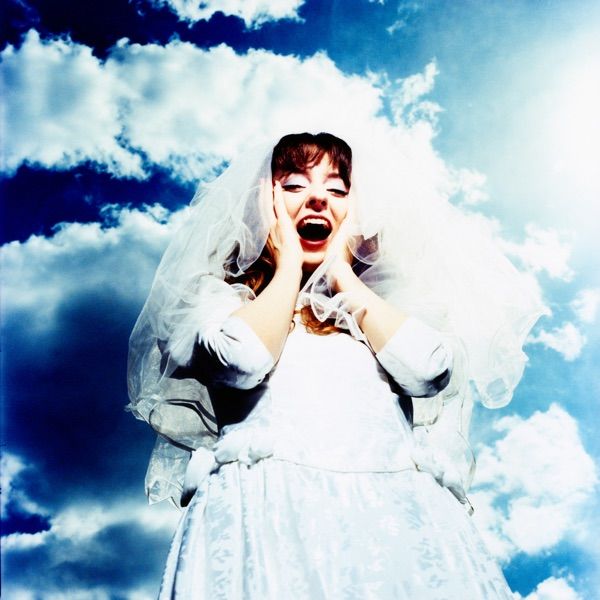 Image may contain Face Head Person Photography Portrait Clothing Dress Fashion Formal Wear Gown and Wedding