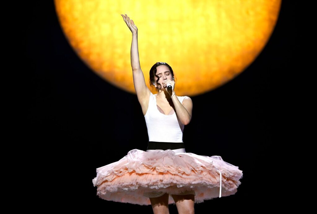 Image may contain Rosalía Performer Person Solo Performance Adult Dancing Leisure Activities Face and Head
