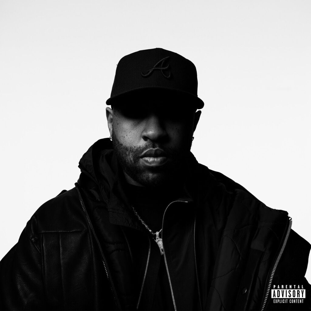 Image may contain Face Head Person Photography Portrait Clothing Coat Jacket Cap Hat Baseball Cap and Adult